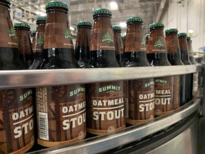 Summit Oatmeal Stout 12oz bottles along line