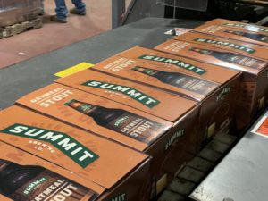 Summit Oatmeal Stout 12pk bottle box along line in February, also National Stout Month